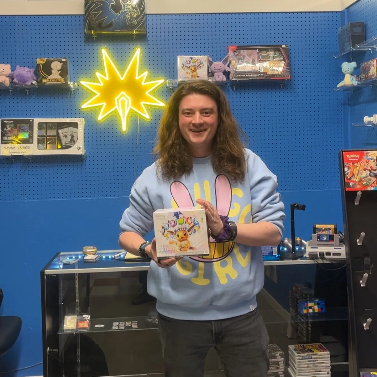 A customer showing off a card at the counter