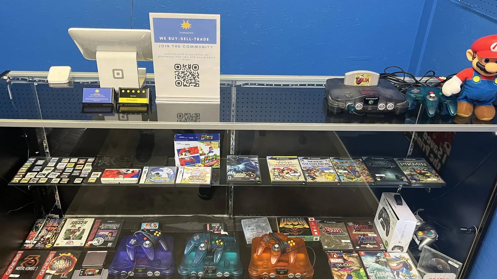 Retro consoles, controllers and boxed games in the case